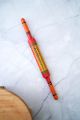 Red and yellow artwork rolling pin