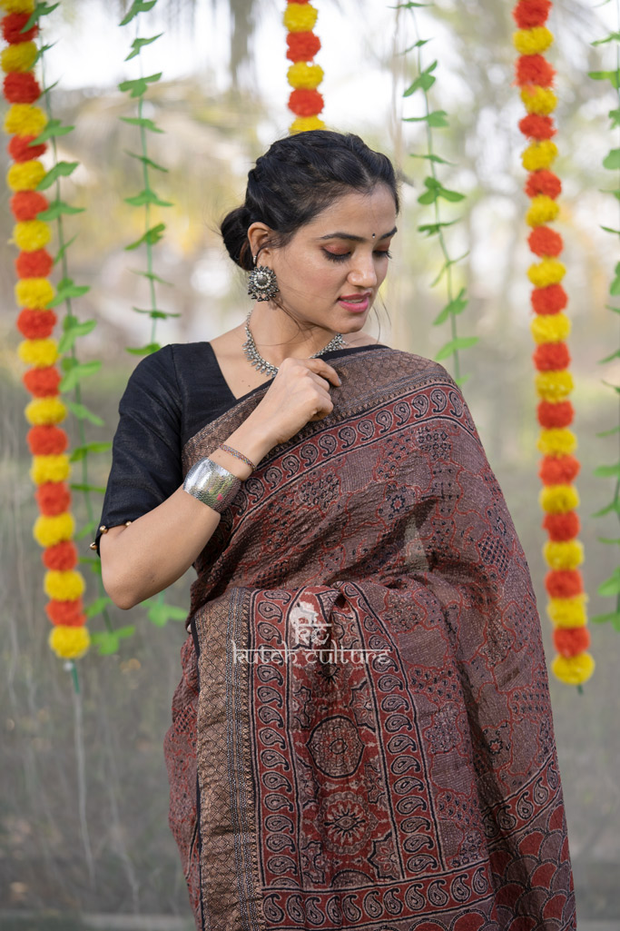 Red ajrakh block print linen silk saree with zari weaving border