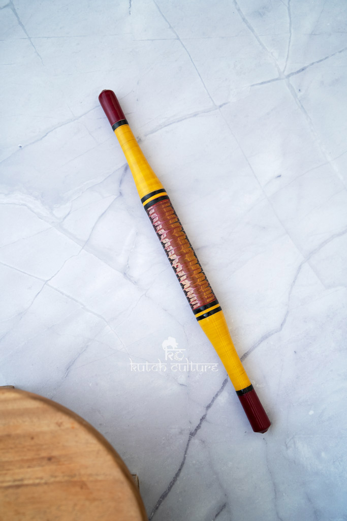 Yellow and red rolling pin