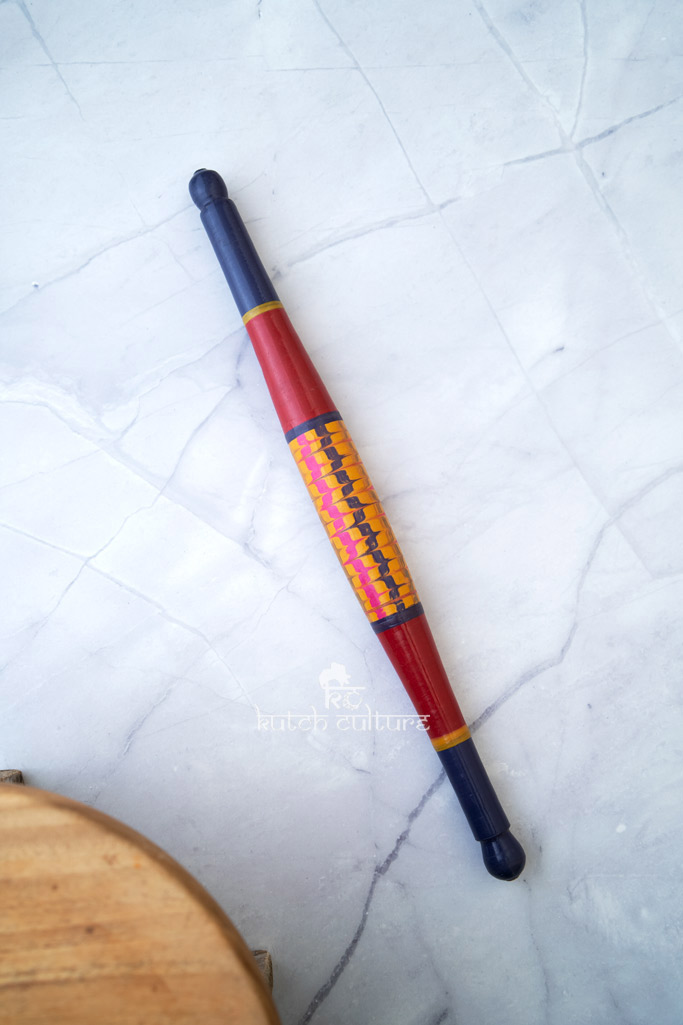 Blue and yellow wooden rolling pin