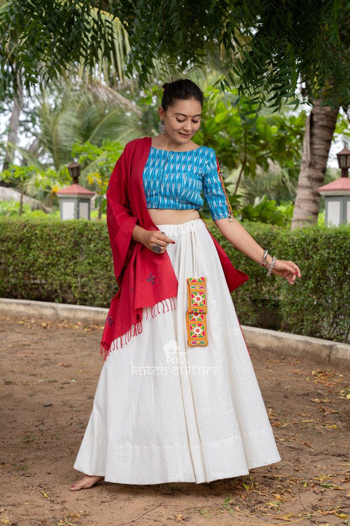 Graceful White Gaghra and Firozi Ikkat Blouse with Kutch Work and Pink Duppata